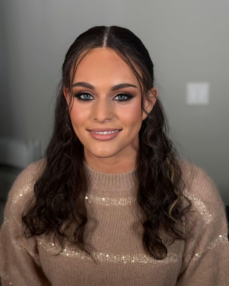 Close-up of smoky bronze eye makeup with soft glam skin